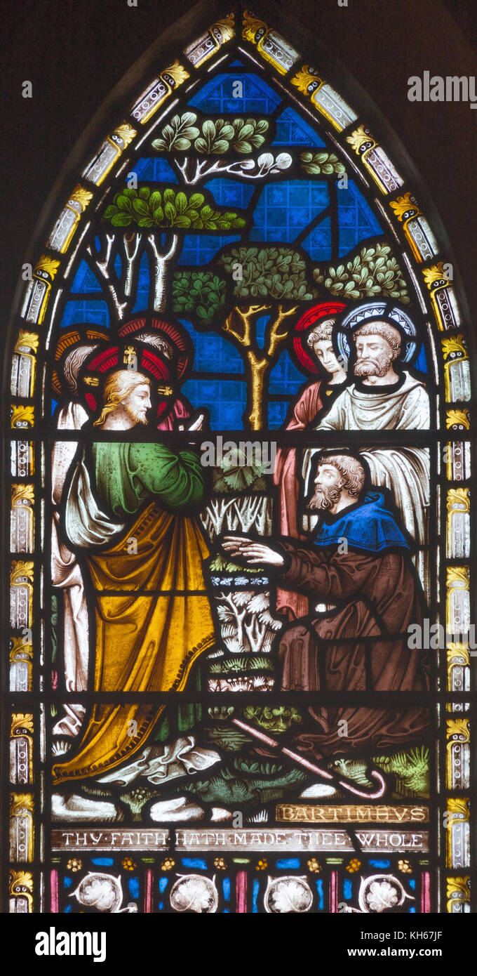 LONDON, GREAT BRITAIN - SEPTEMBER 19, 2017: The Jesus Heals Blind Bartimaeus on the stained glass in St Mary Abbot's church on Kensington High Street. Stock Photo