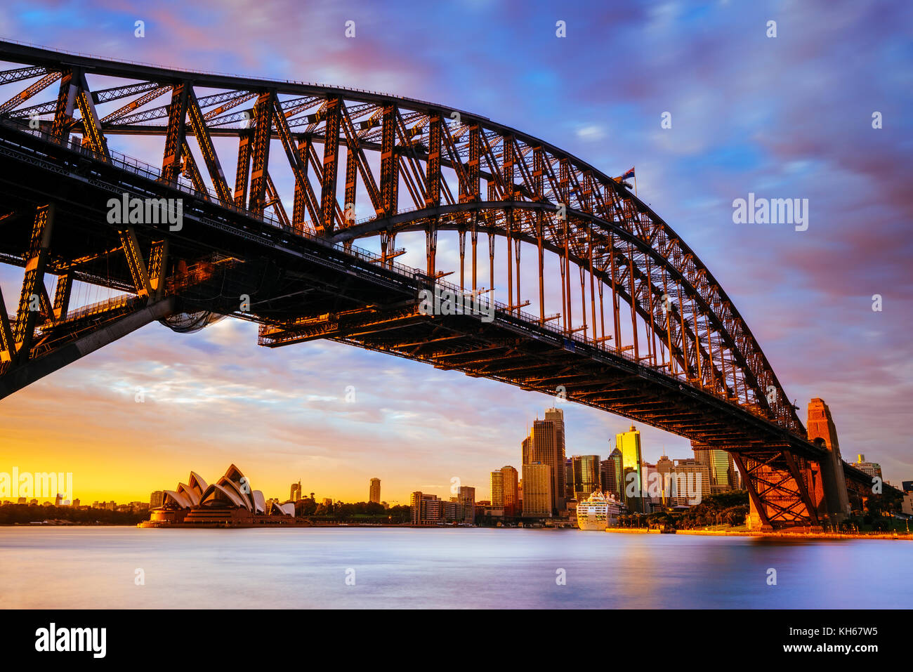 Sunrise at Harbour Bridge and Sydney Opera House, Milsons Point, Sydney, New South Wales, Australia Stock Photo