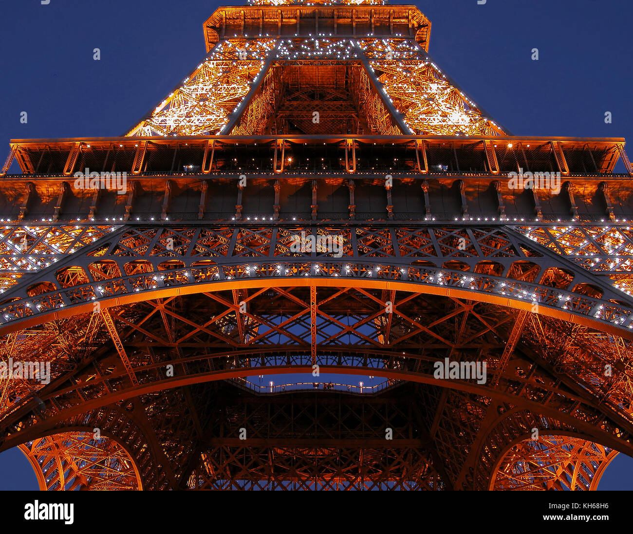 Eiffel Tower, Paris, France: detail of the first and second levels, illuminated at night Stock Photo