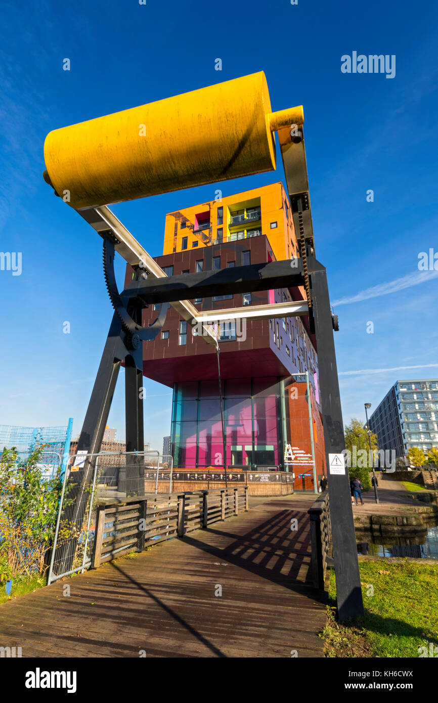 The Chips apartment building, by Will Alsop, and a bascule lifting bridge, by the Ashton Canal, New Islington, Ancoats, Manchester, UK Stock Photo