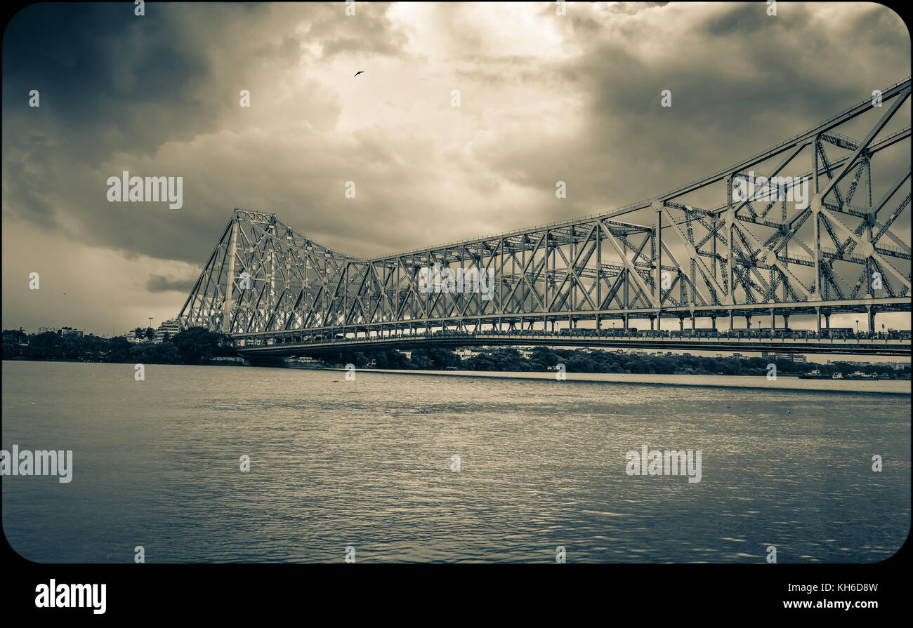 Historic Howrah bridge at Kolkata on river Hooghly in monochromatic effect Stock Photo