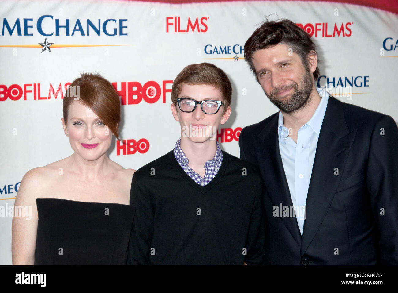 Julianne Moore with son Caleb Freundlich and husband Bart Freundlich at the screening of HBO Films Game Change at the Ziegfeld Theater in New York City. March 7, 2012. © Kristen Driscoll/Mediapunch Inc. Stock Photo