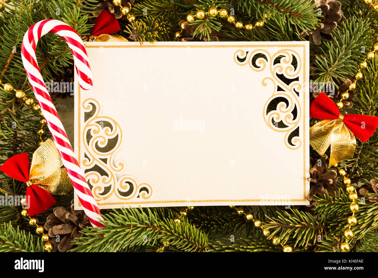 Christmas frame with a candy and blank greeting card with copy space ...