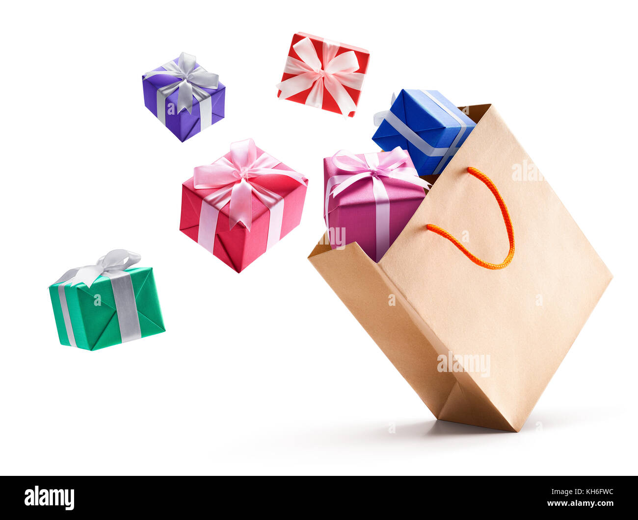 Gift boxes pop out from paper bag isolated on white background Stock Photo