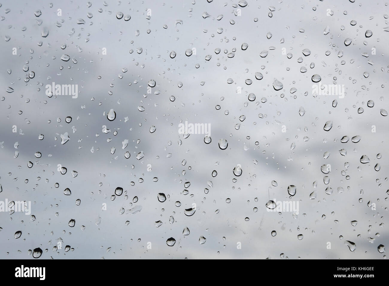 Raindrops on a window glass closeup Stock Photo - Alamy