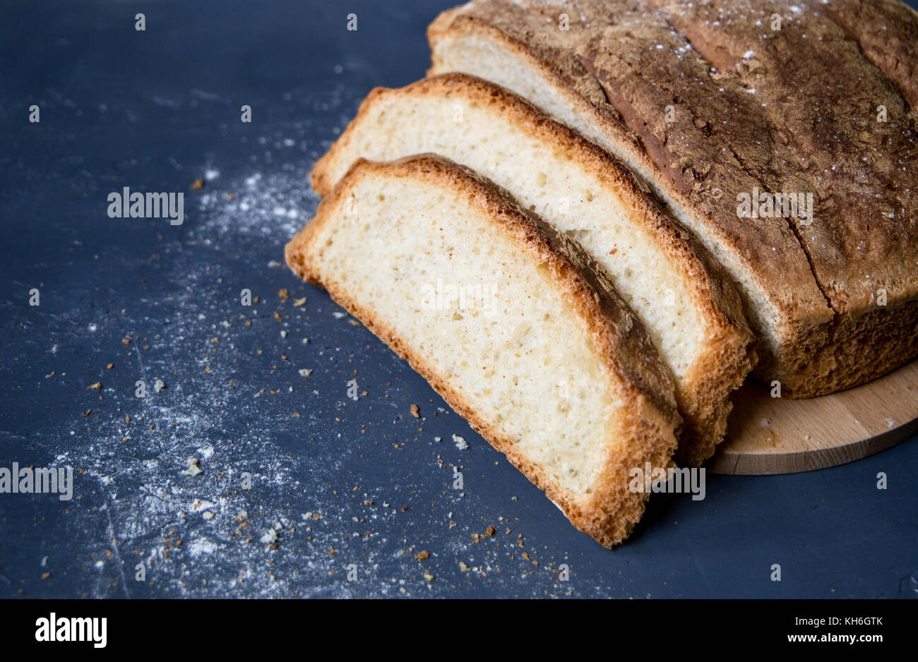 freshly baked bread on rustic wooden table Stock Photo - Alamy