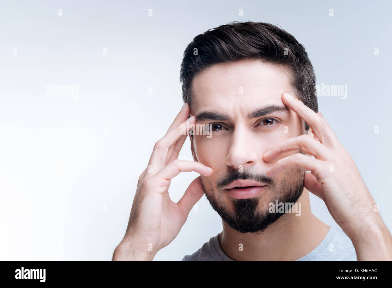 Clever young specialist generating genius ideas Stock Photo - Alamy