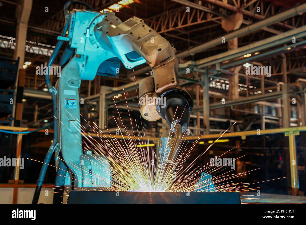 Team robots are welding automotive part. Stock Photo