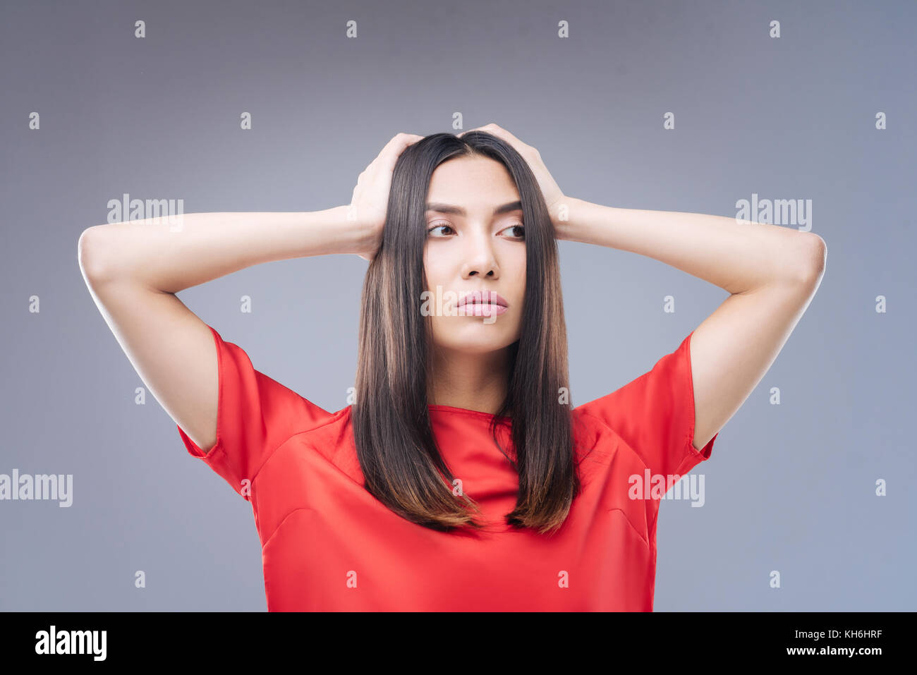 Curious young woman having no idea what to do with her life Stock Photo Alamy