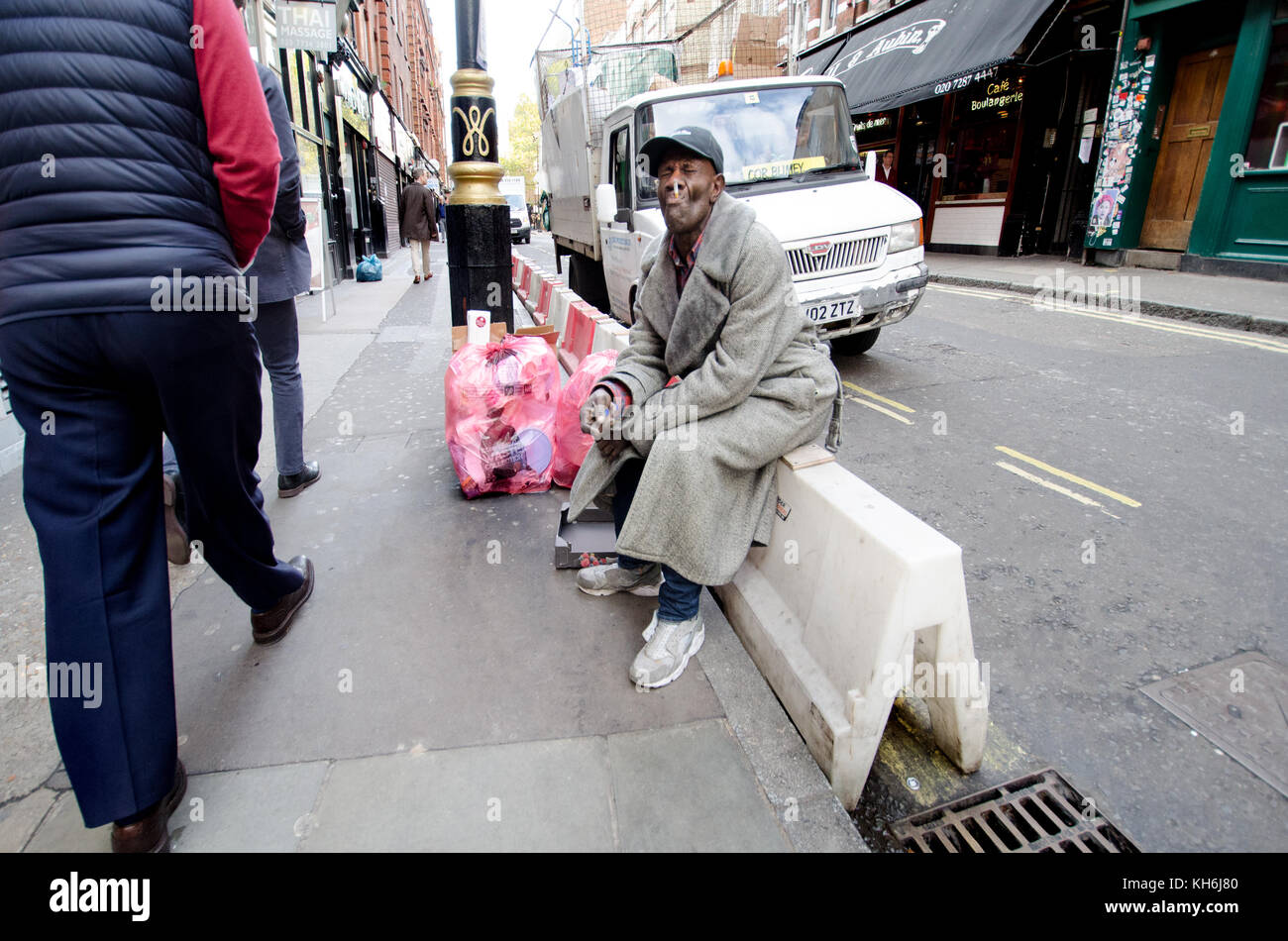 London, England, UK. Man smoking in the street Stock Photo