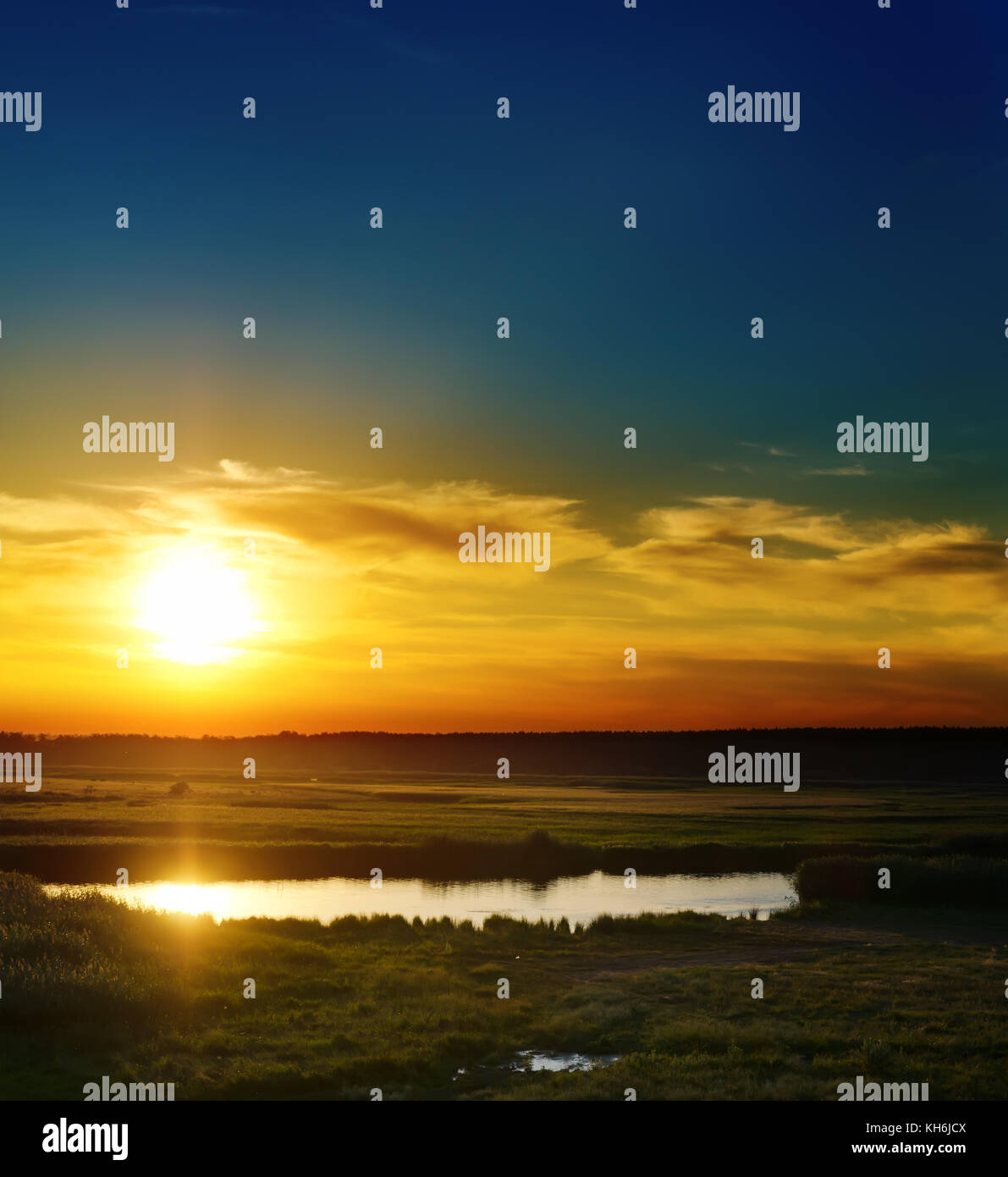 good dramatic sunset over river Stock Photo - Alamy
