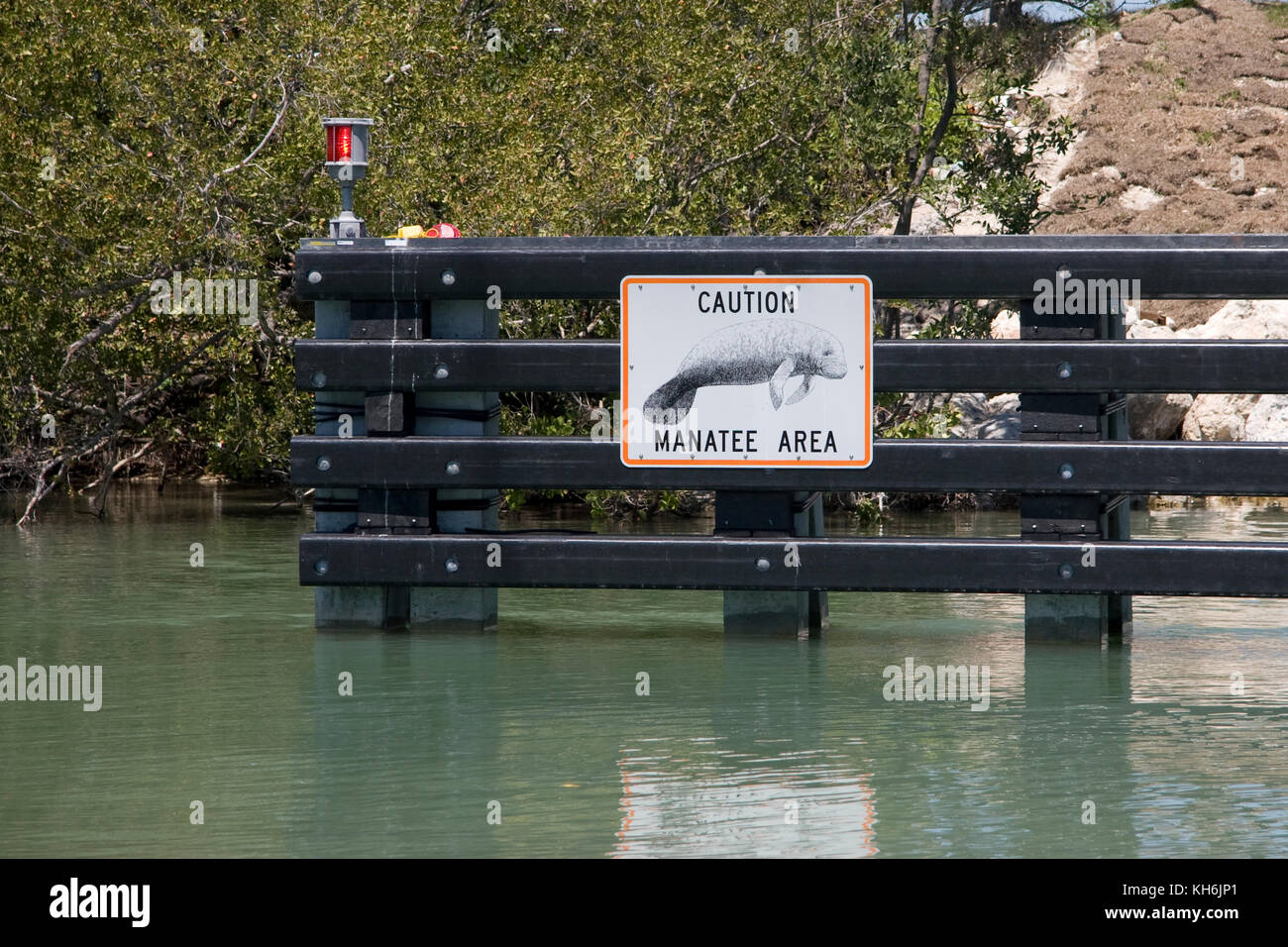 Manatee warning sign on the Intracoastal Waterway, Key Largo, Florida Stock Photo