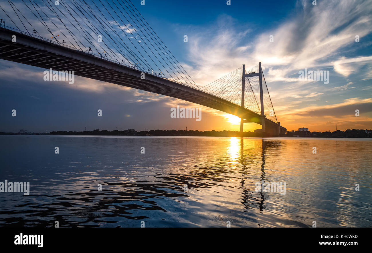 Vidyasagar Setu - The Cable stayed bridge on river Hooghly at sunset. Photograph taken from Princep Ghat Kolkata India Stock Photo