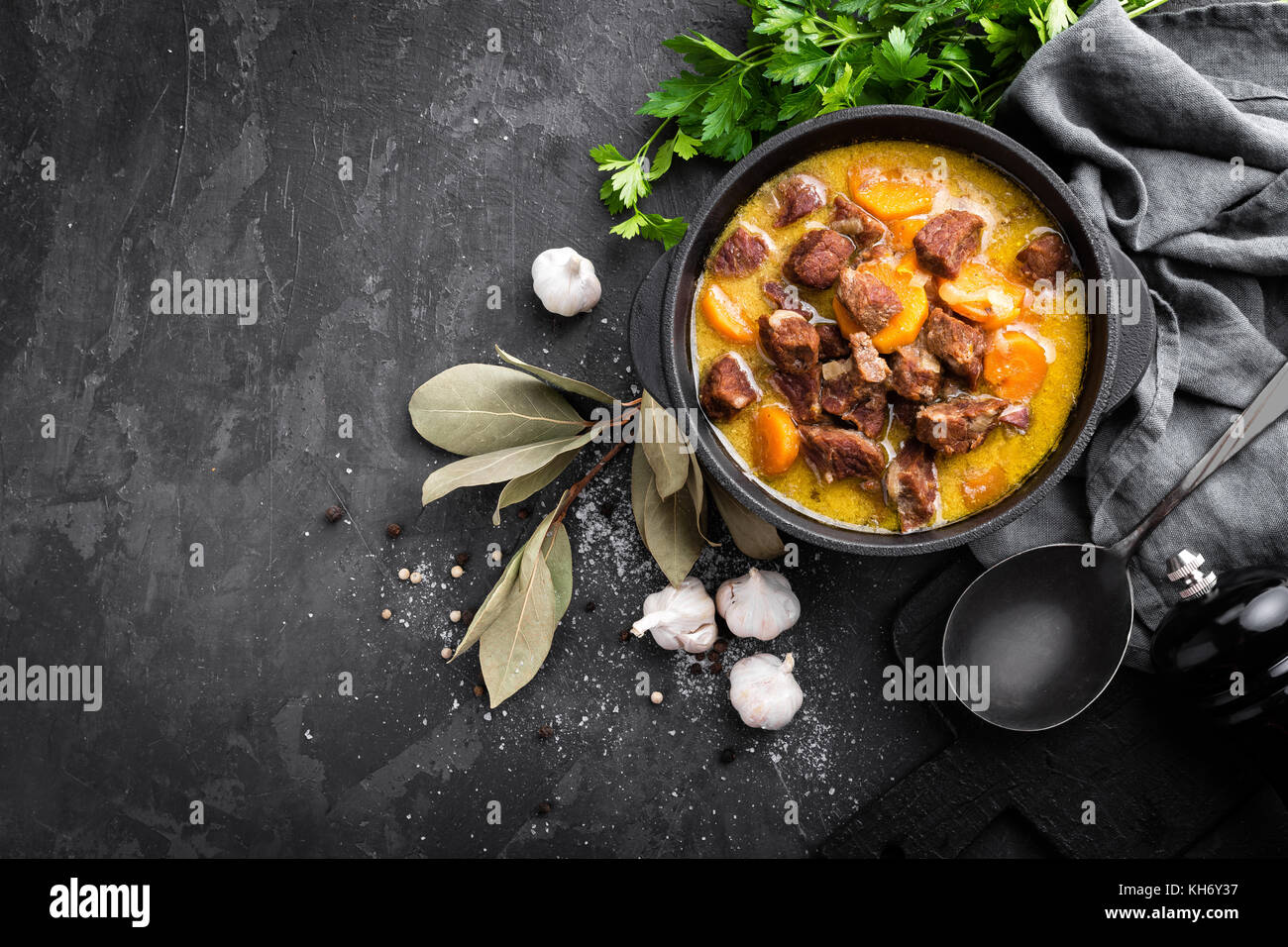 Meat stew, goulash in a cast iron pot, top view Stock Photo Alamy