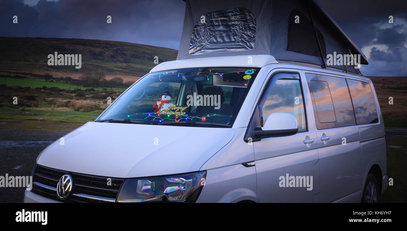 Camping in a VW campervan with christmas lights in windscreen Preseli