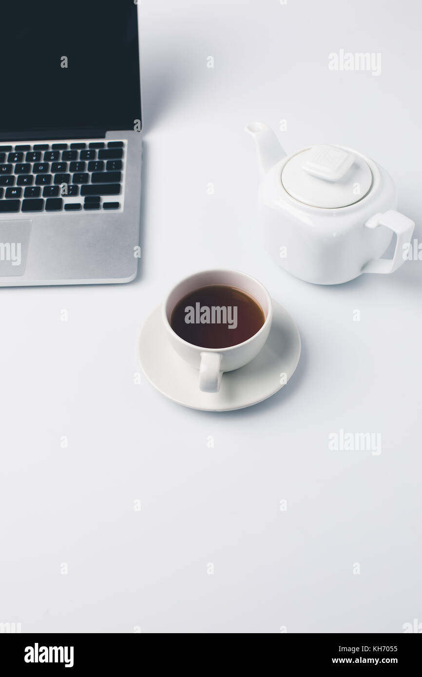 cup of tea and laptop Stock Photo Alamy