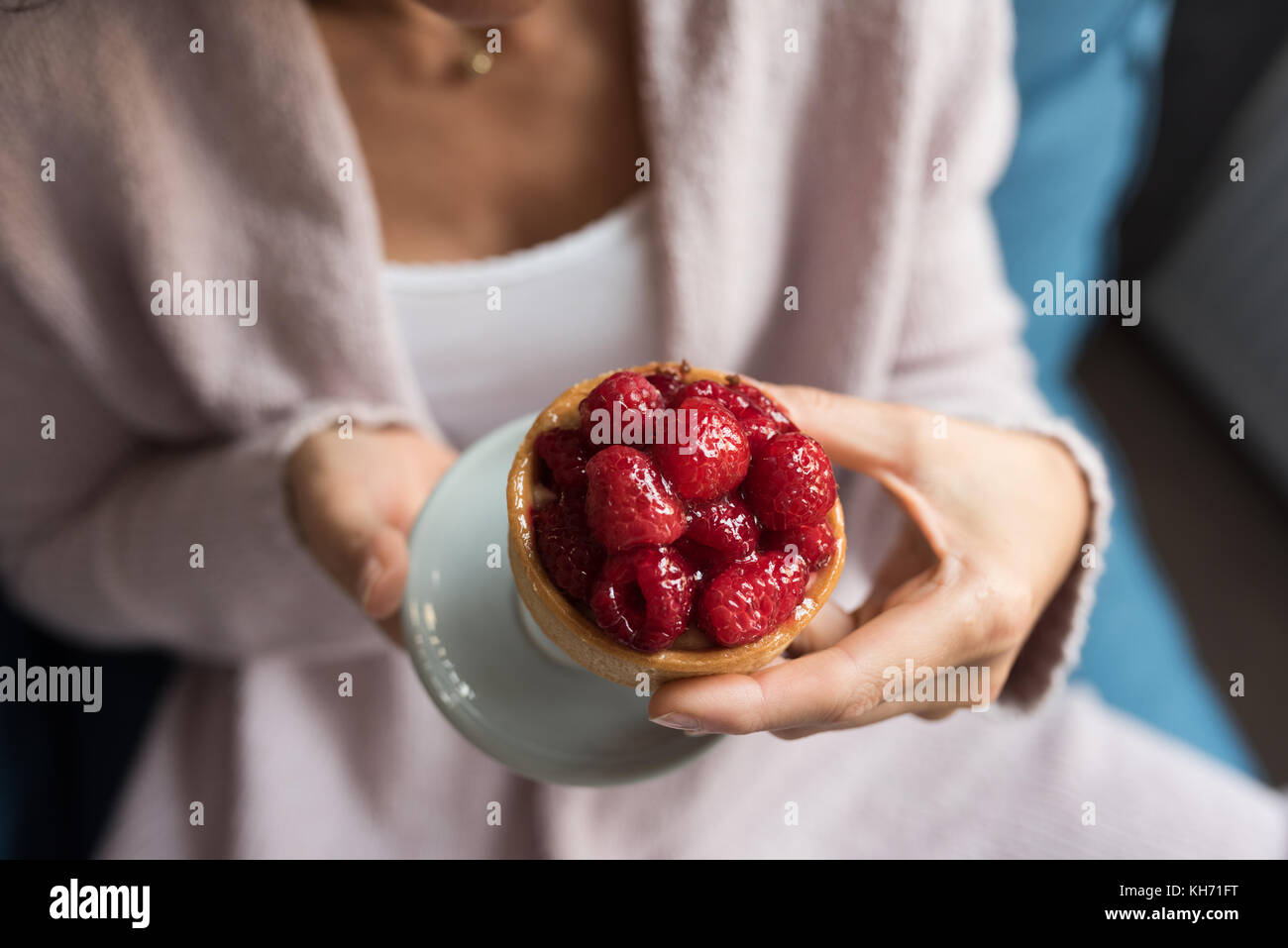 Mid-section of eautiful woman holding dessert Stock Photo