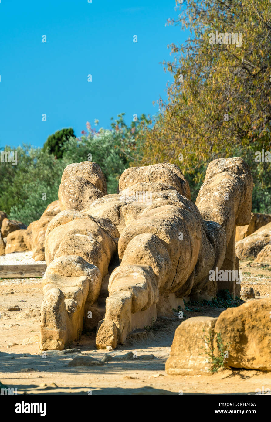 Fallen statue of Atlas at the Temple of Olympian Zeus in the Valley of Temples near Agrigento, Sicily Stock Photo