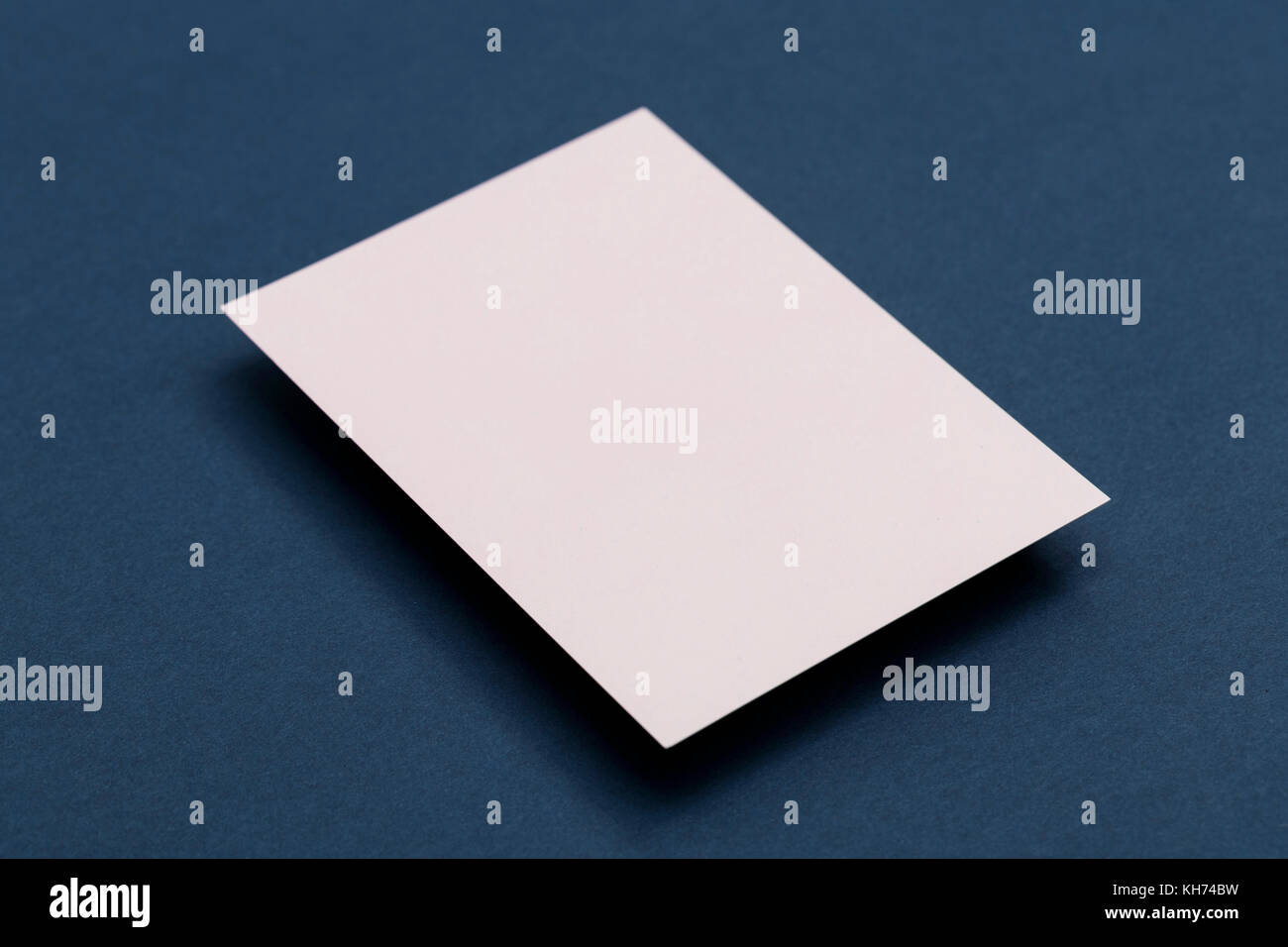 Blank white business card postcard flyer on a blue background Stock ...