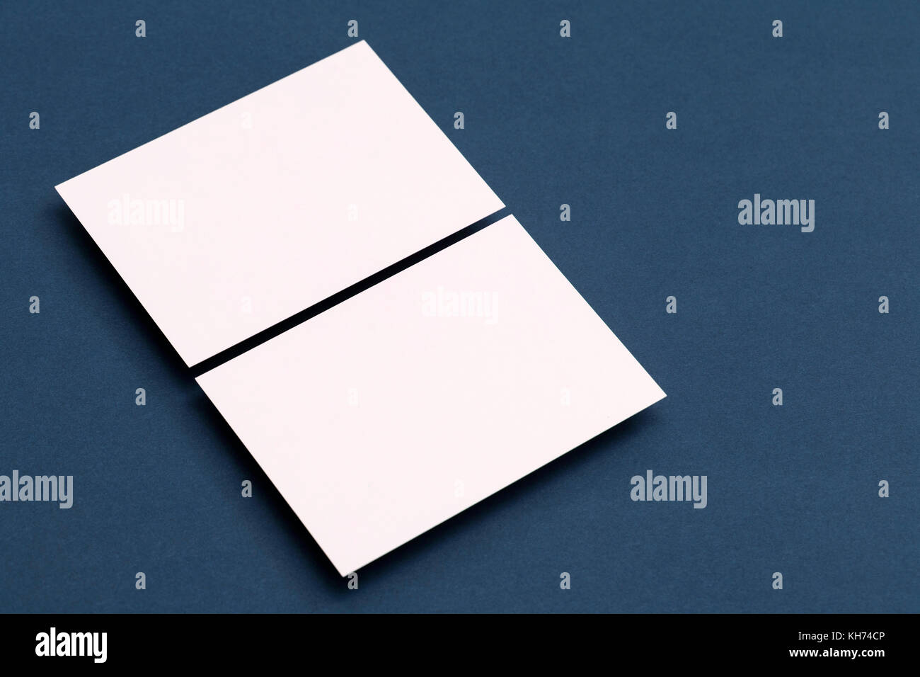 Blank white business card postcard flyer on a blue background Stock ...