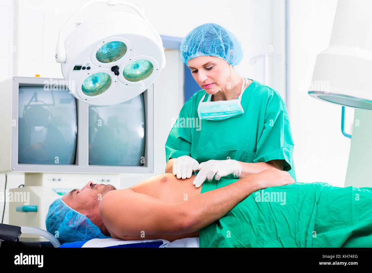 Orthopedic surgeon doctor operating patient in surgery or hospital ...