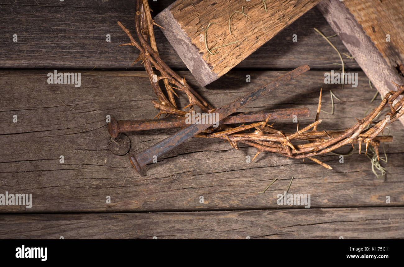 Crown of thorns and nails on a wood surface Stock Photo - Alamy