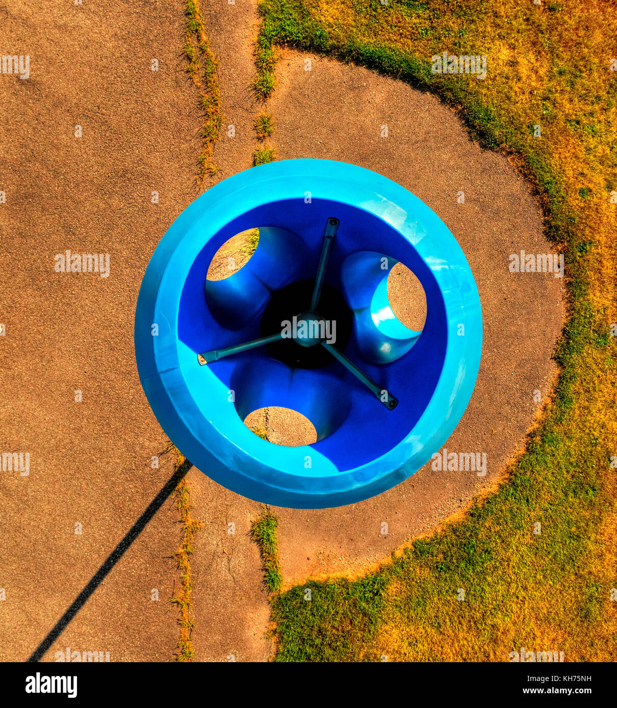 Pole aerial High Dynamic Range (HDR) image of a blue funnel ball structure on a playground. Stock Photo