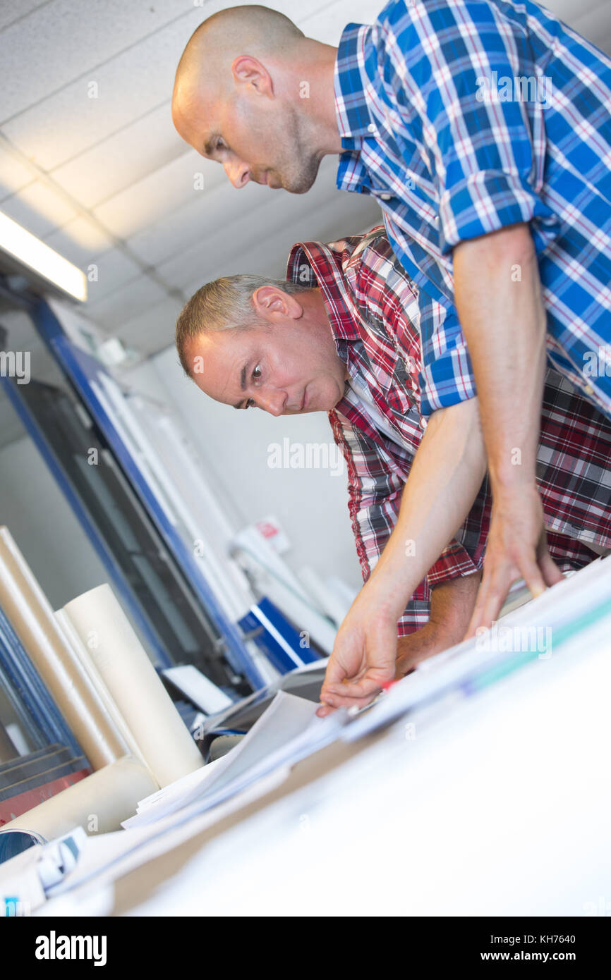 colleagues working at a printer shop Stock Photo Alamy