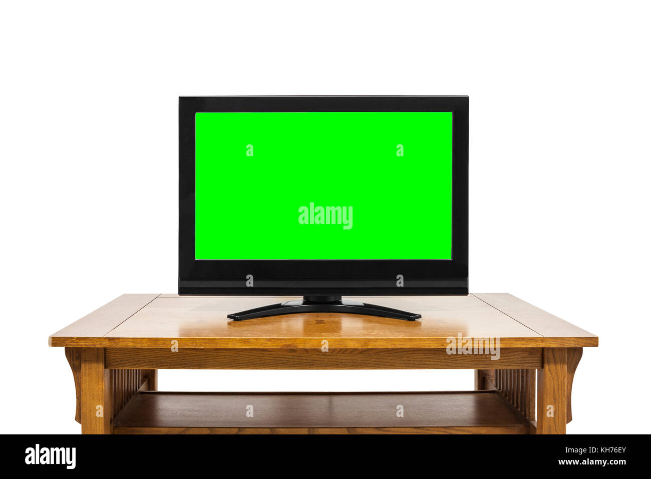 Flat screen television on wood table isolated on white with chroma key