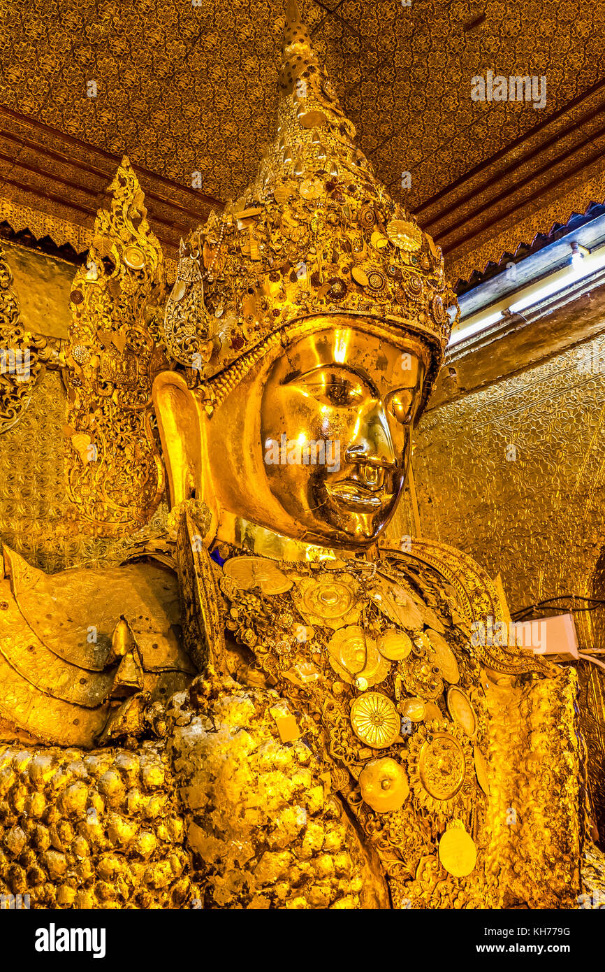 Golden Buddha statue in the Mahamuni Buddha Temple, Mandalay, Myanmar Stock Photo