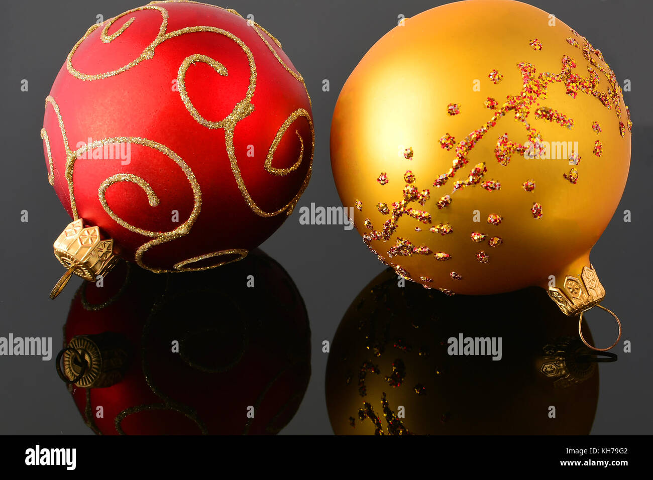 Red and gold christmas balls on black background Stock Photo - Alamy