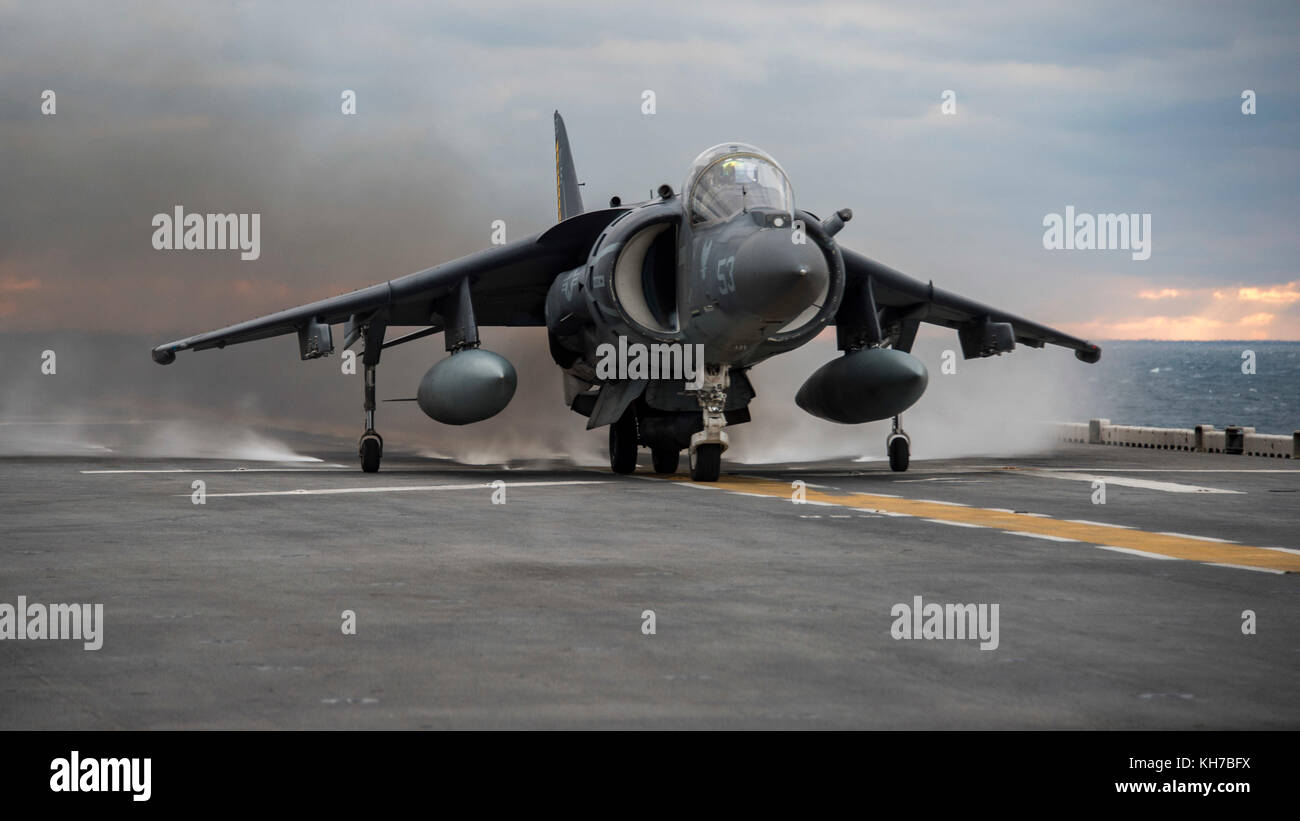 An AV-8B Harrier II jet, assigned to Marine Medium Tiltrotor Squadron 162, takes off from the fligh Stock Photo