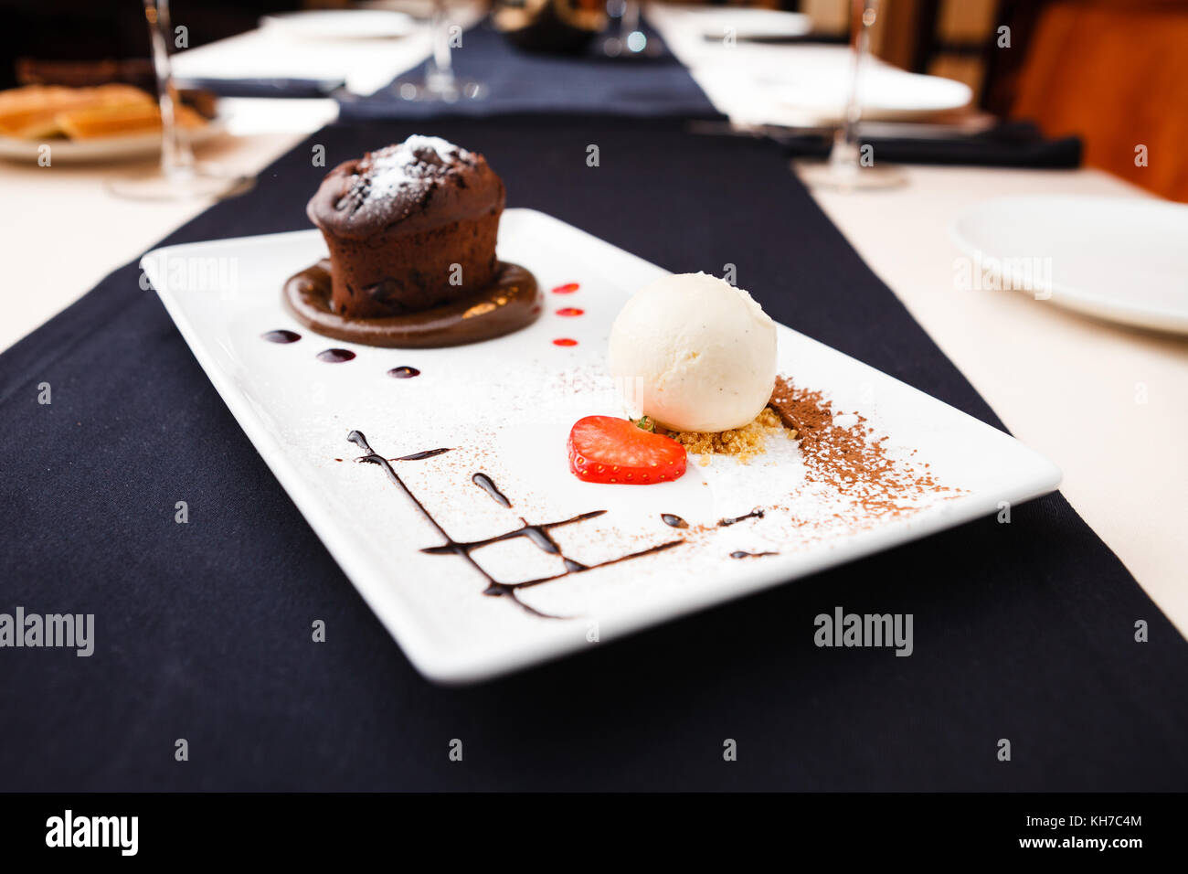 Chocolate fondant with vanilla ice cream and raspberry sauce Stock ...