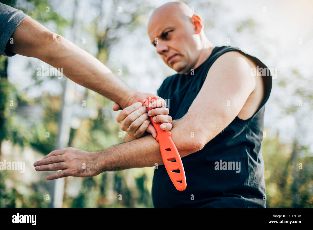 Kapap instructor demonstrates martial arts self defense disarming