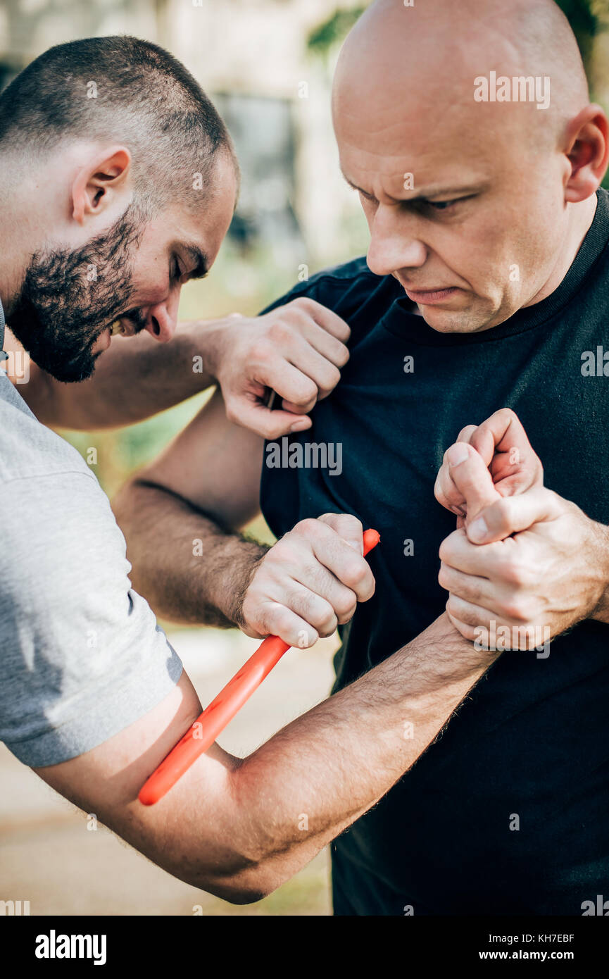 Kapap instructor demonstrates martial arts self defense disarming