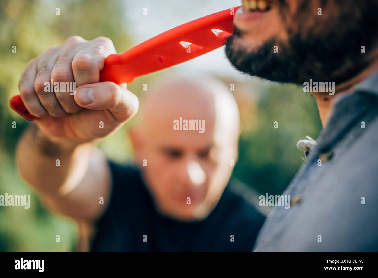 Kapap instructor demonstrates martial arts self defense disarming