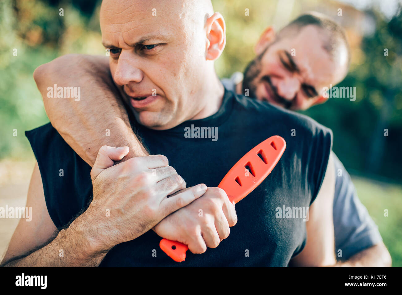 Kapap instructor demonstrates martial arts self defense disarming