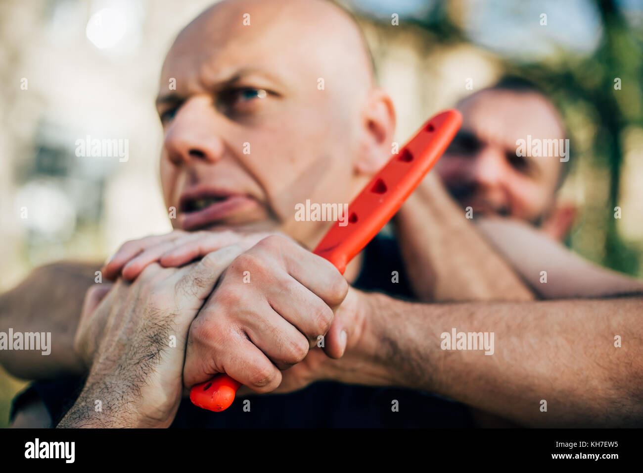 Kapap instructor demonstrates martial arts self defense disarming