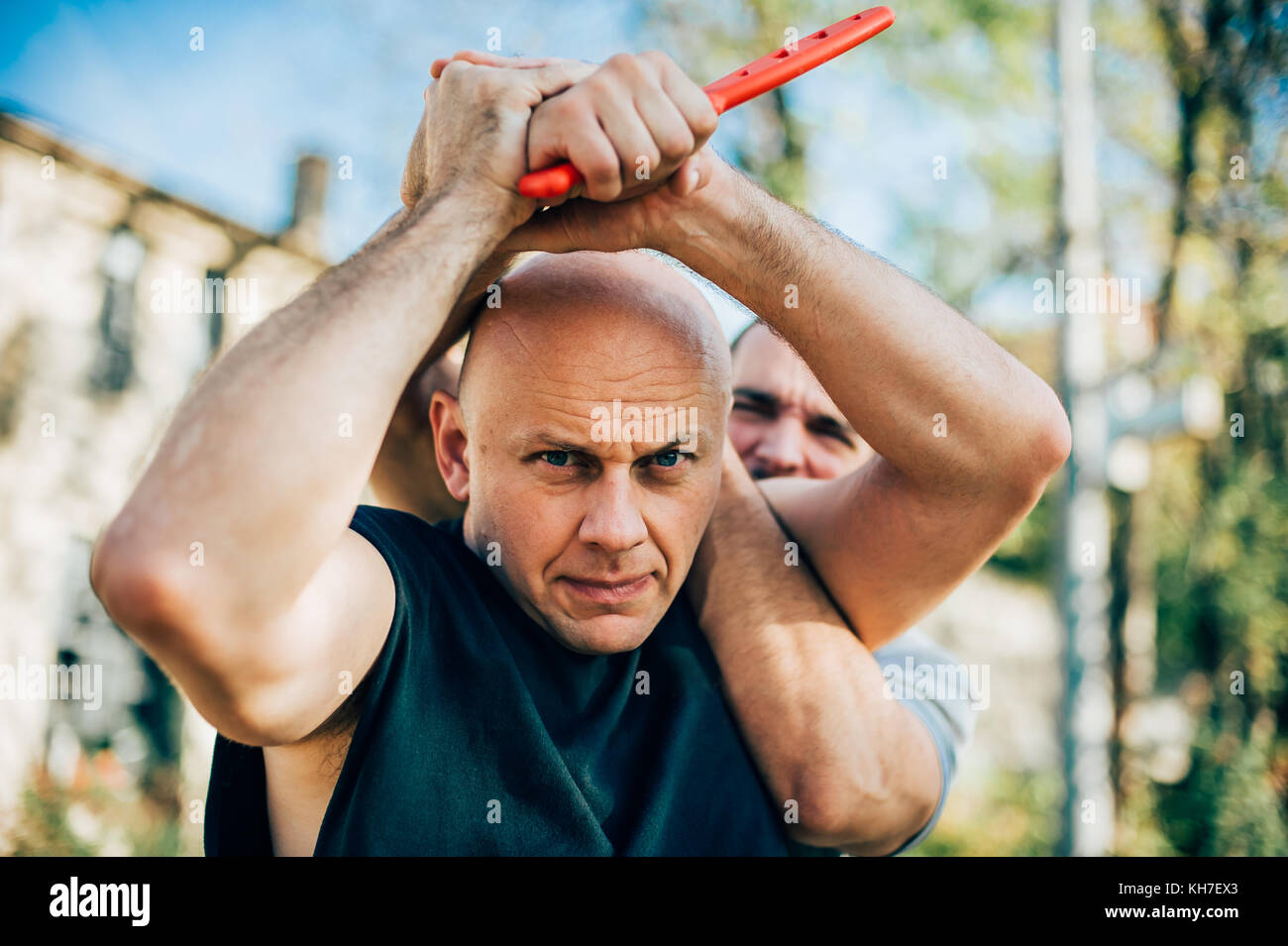Kapap instructor demonstrates martial arts self defense disarming