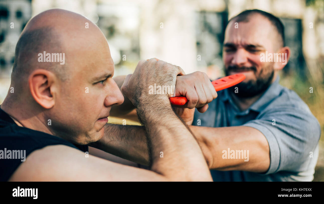 Kapap instructor demonstrates martial arts self defense disarming