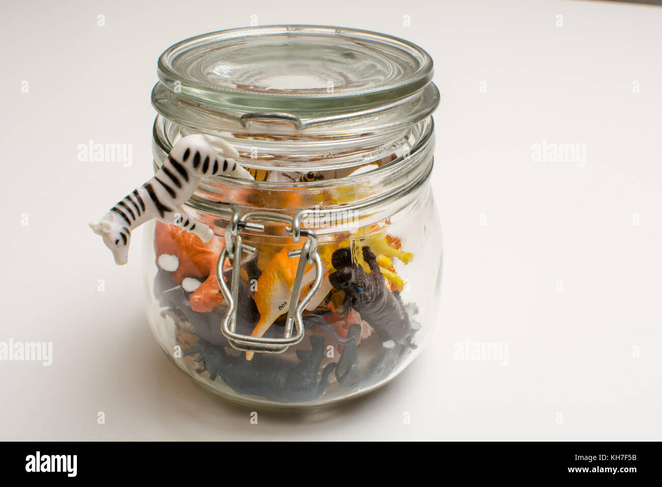 Wild animals in captivity concept of safari animals in a jar Stock