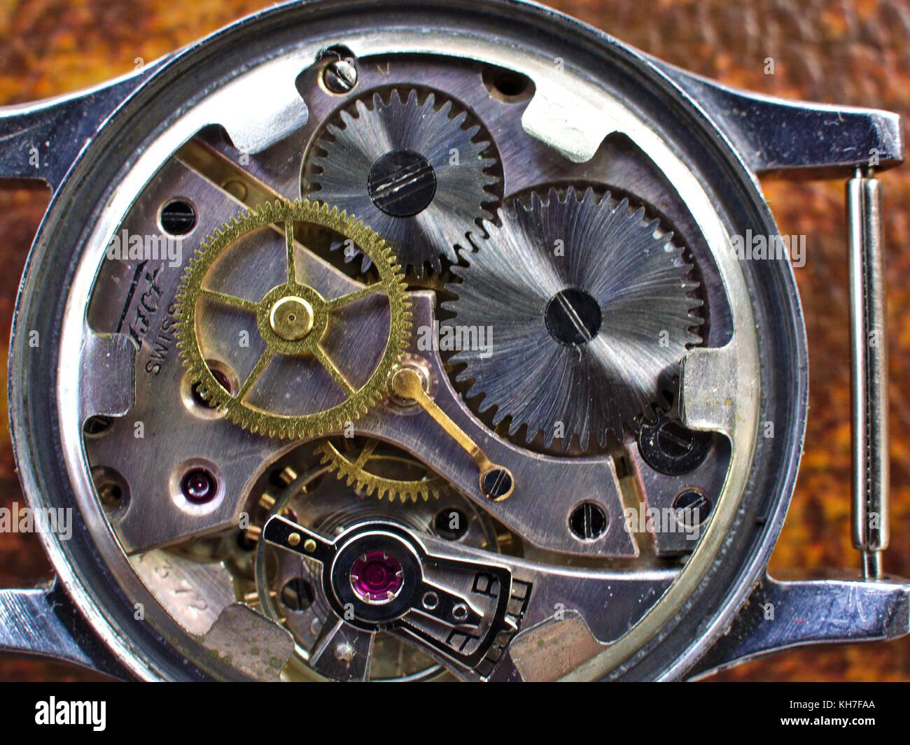 Clock mechanism of an old Swiss watch.Precision craftsmanship of real watchmakers Stock Photo