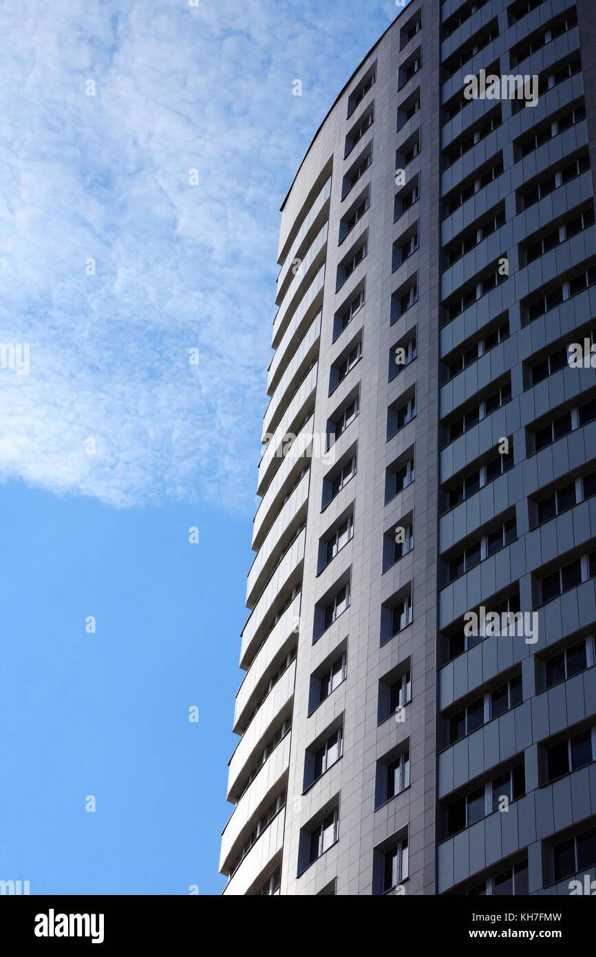 Closeup of high modern building on blue sky background Stock Photo - Alamy