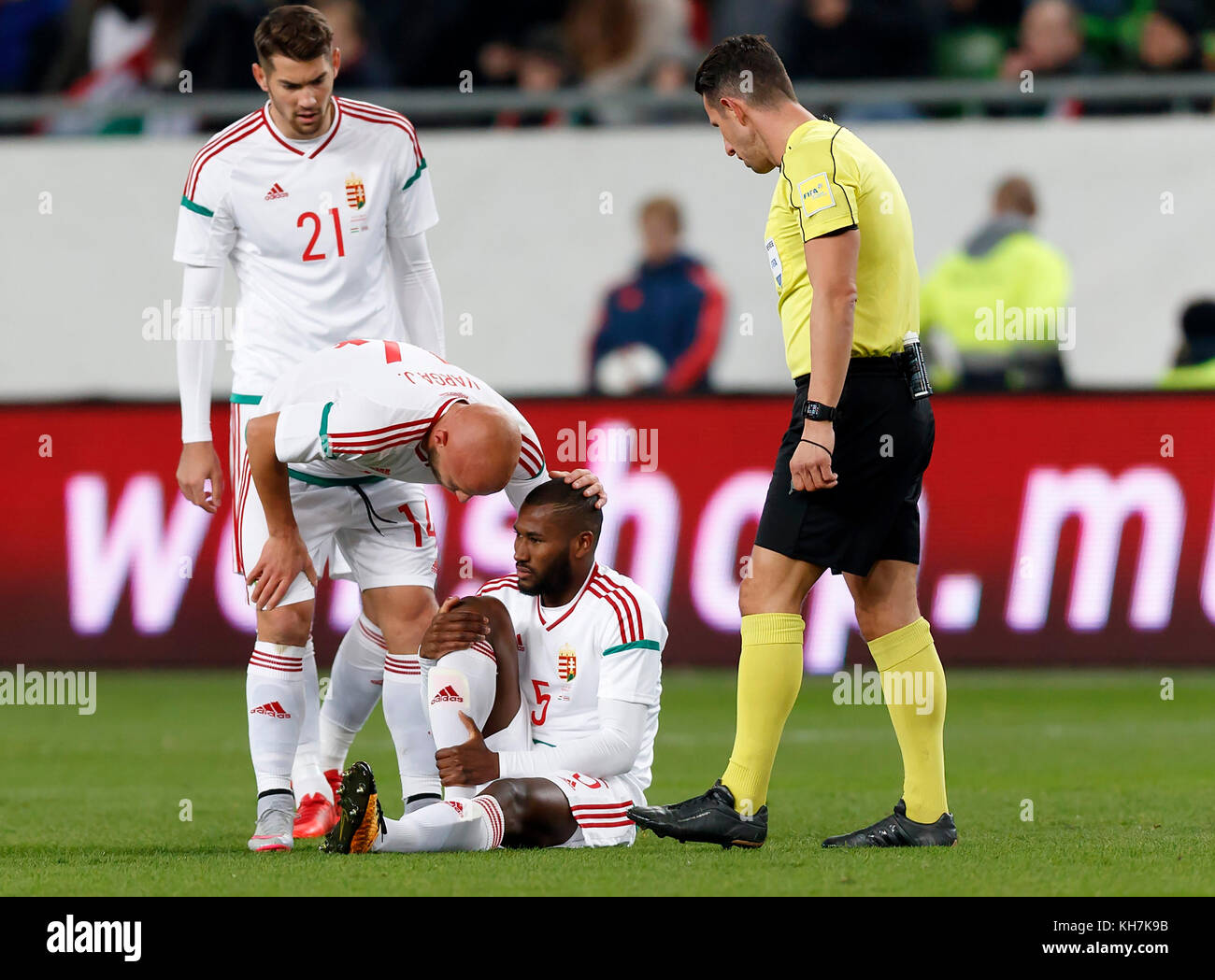 Budapest, Hungary. 14th Nov, 2017. Paulo Vinicius #5 of Hungary sits injured on the ground next to Barnabas Bese #21 of Hungary, Jozsef Varga #14 of Hungary and referee Alexander Harkam during the at Groupama Arena on November 14, 2017 in Budapest, Hungary. Credit: Laszlo Szirtesi/Alamy Live News Stock Photo