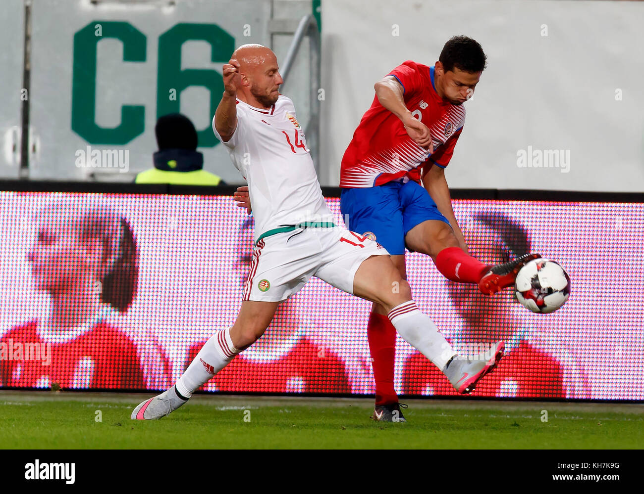 Budapest, Hungary. 14th Nov, 2017. Daniel Colindres (R) of Costa Rica crosses the ball next to Jozsef Varga #14 of Hungary during the at Groupama Arena on November 14, 2017 in Budapest, Hungary. Credit: Laszlo Szirtesi/Alamy Live News Stock Photo