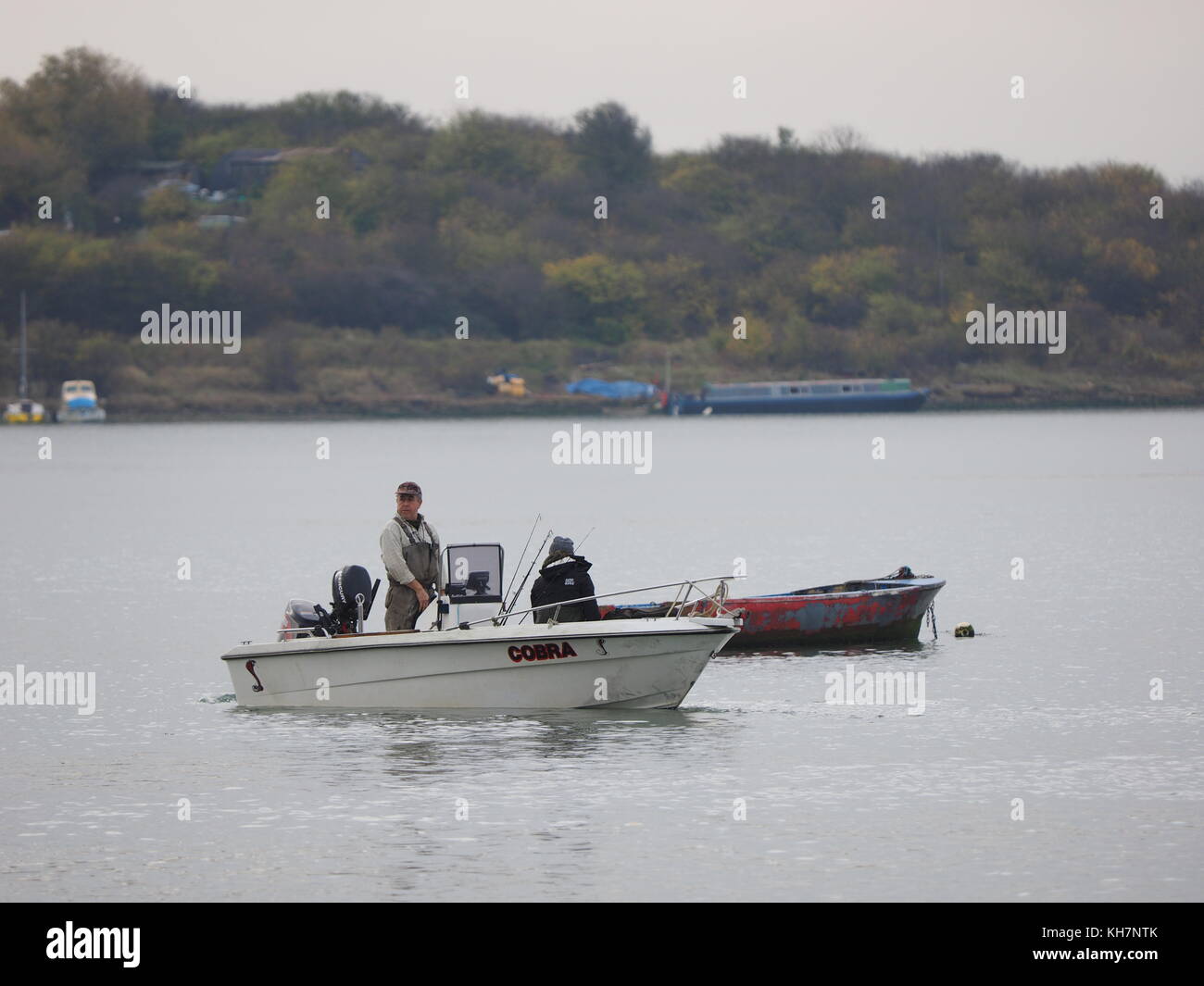Queenborough, Kent, UK. 15th Nov, 2017. UK Weather: a calm and relatively mild November day in the historic town of Queenborough on the Isle of Sheppey. A small fishing boat gets ready for the off. Credit: James Bell/Alamy Live News Stock Photo