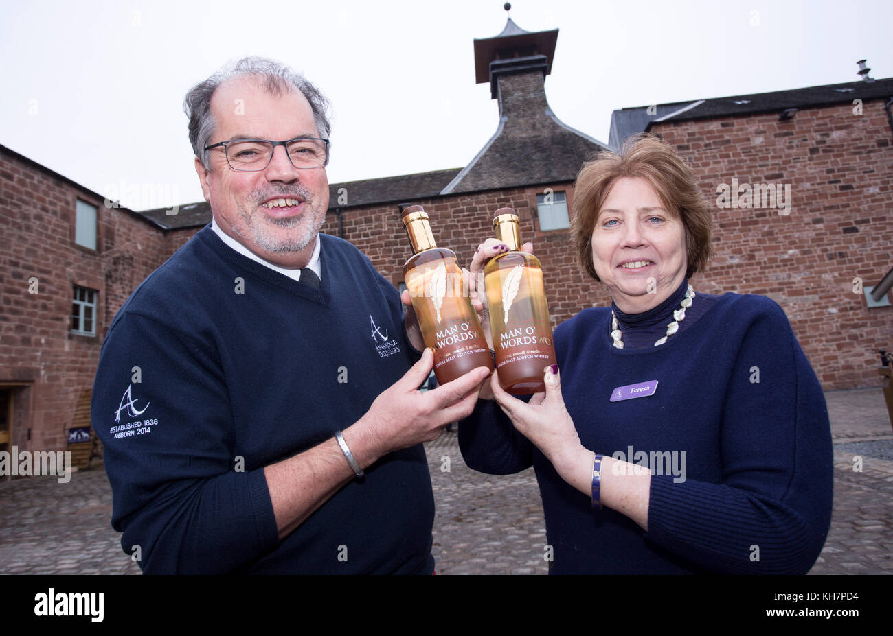 David Thompson and Teresa Church with the first two bottle of Man O' Words single malt whisky produced at Annandale Distillery after 99 years near Annan, Scotland Stock Photo
