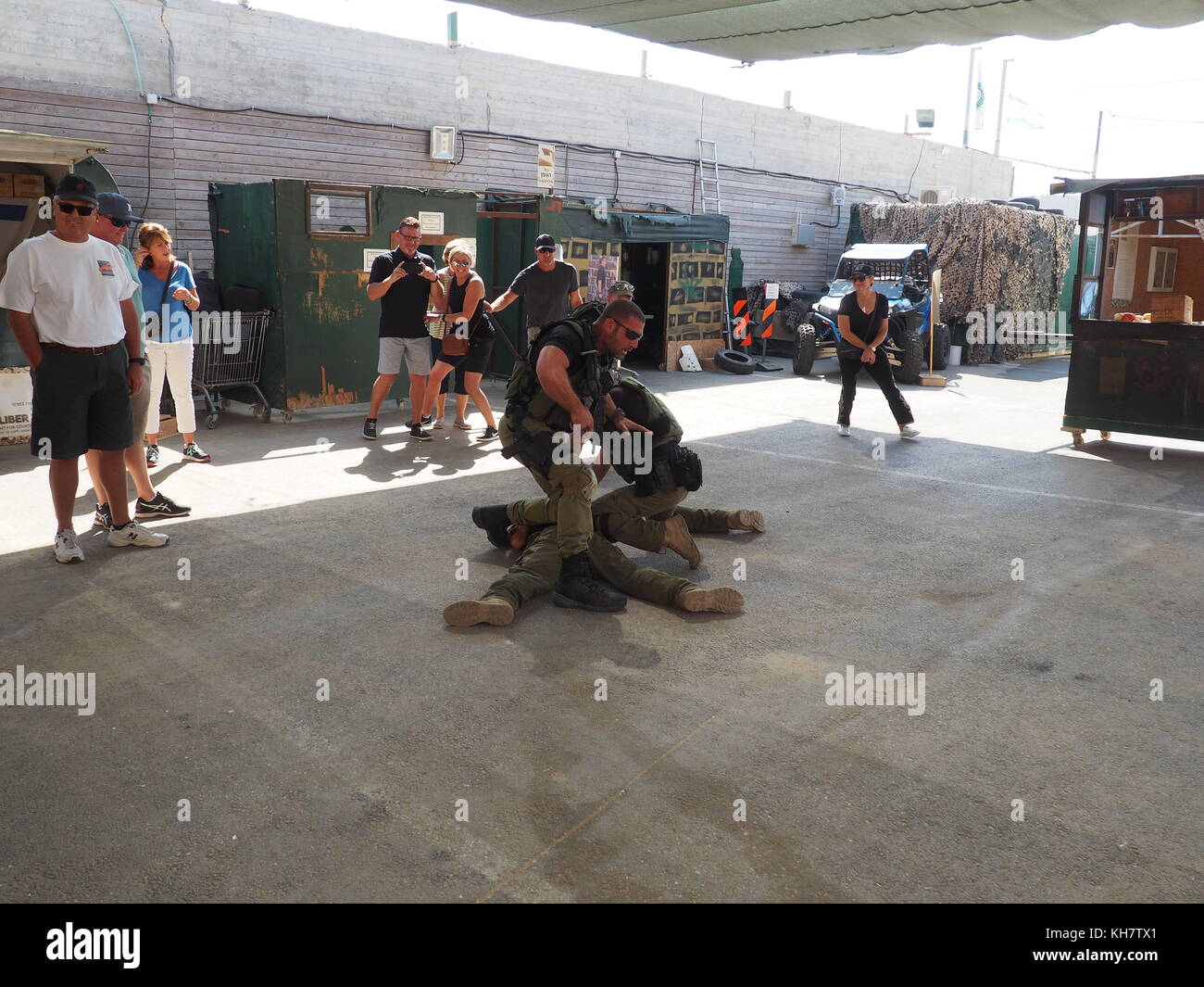 The head of the combat trainers, Eitan Cohen (front L), overwhelms an