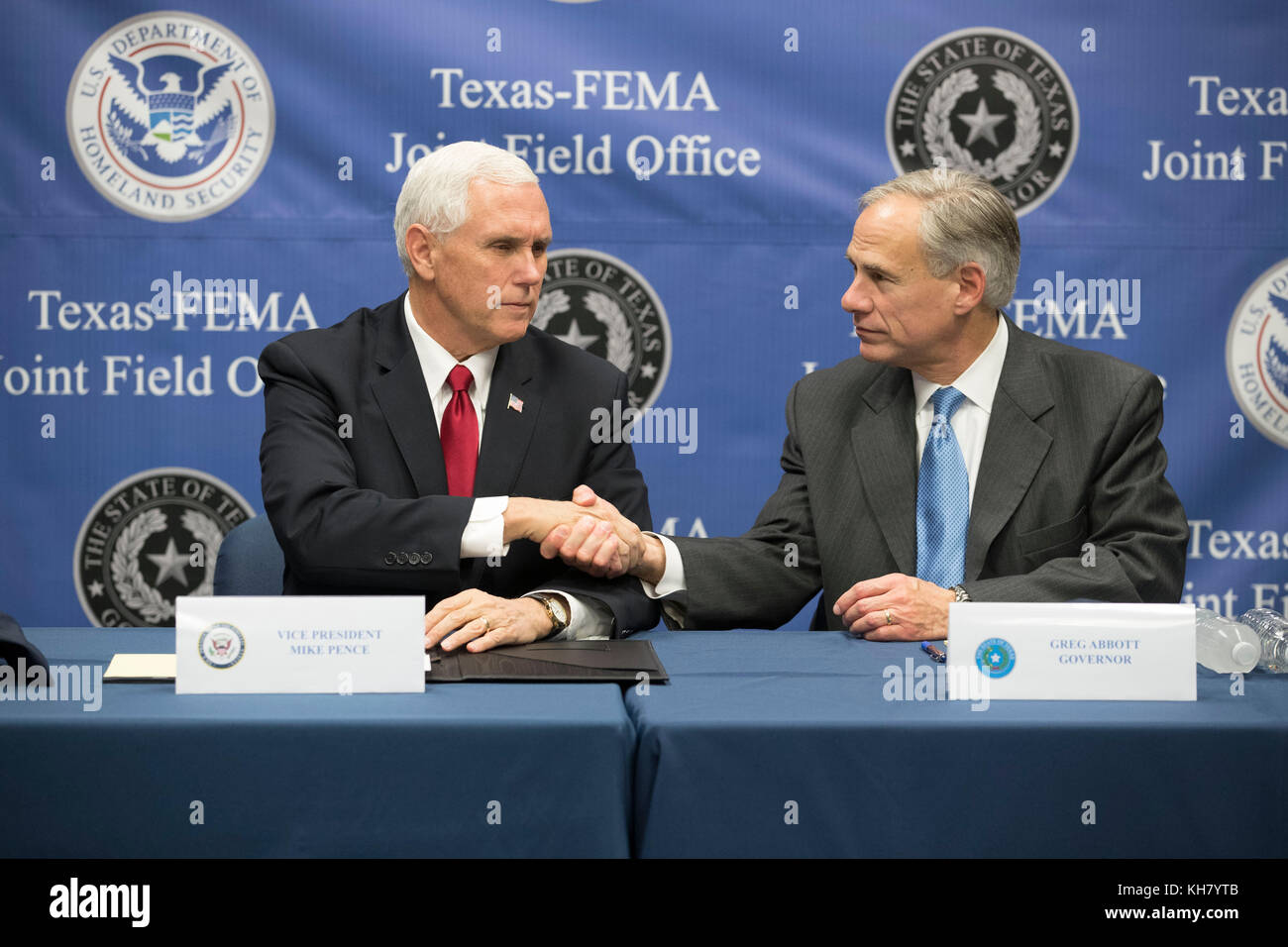 Austin, USA. 15th Nov, 2017. U.S. Vice President Mike Pence (left) greets Gov. Greg Abbott as he visits Federal Emergency Management Agency (FEMA) Texas regional office with Energy Secy. Rick Perry for a Hurricane Harvey recovery update from Texas Gov. Greg Abbott. Credit: Bob Daemmrich/Alamy Live News Stock Photo