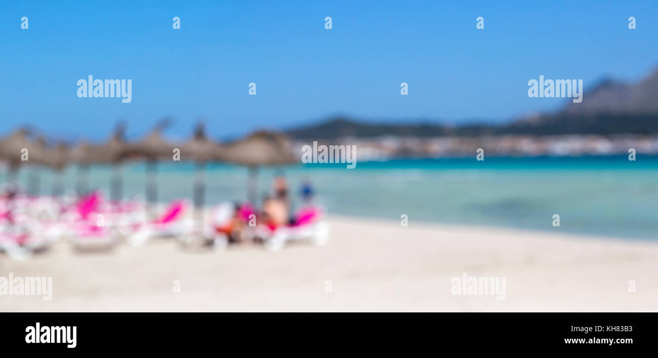 Blurred people on white sand beach, summer holiday background concept Stock Photo